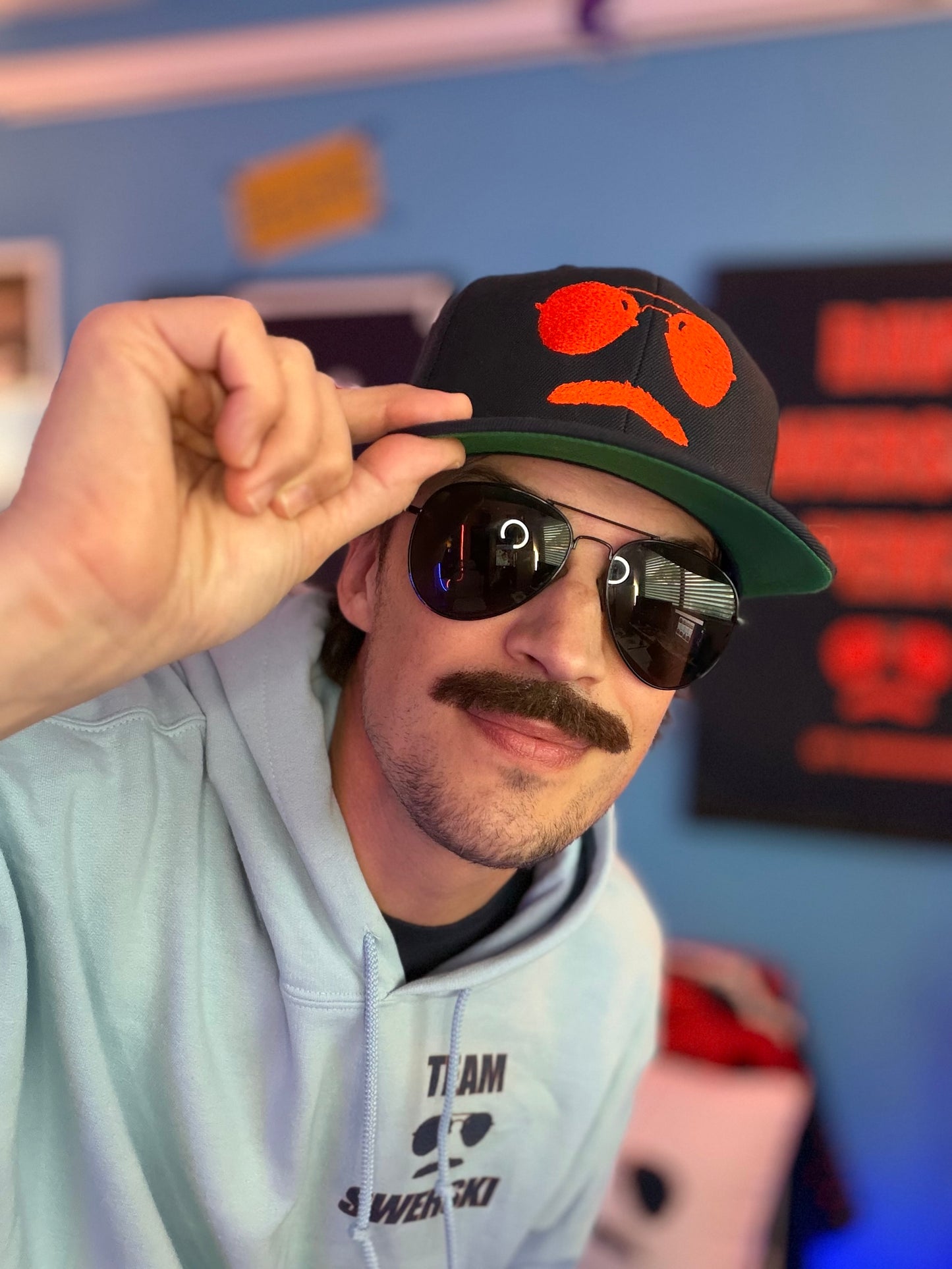 Swerski Stache and Shades Logo Snapback Hat - Navy with Orange Logo